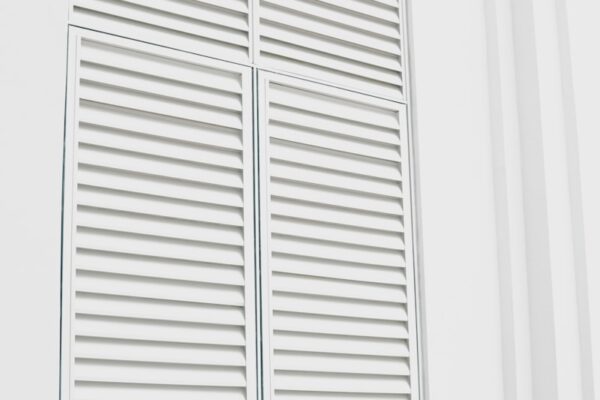 white wooden louvered door