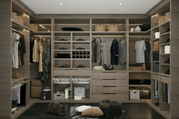 a walk in closet filled with lots of clothes